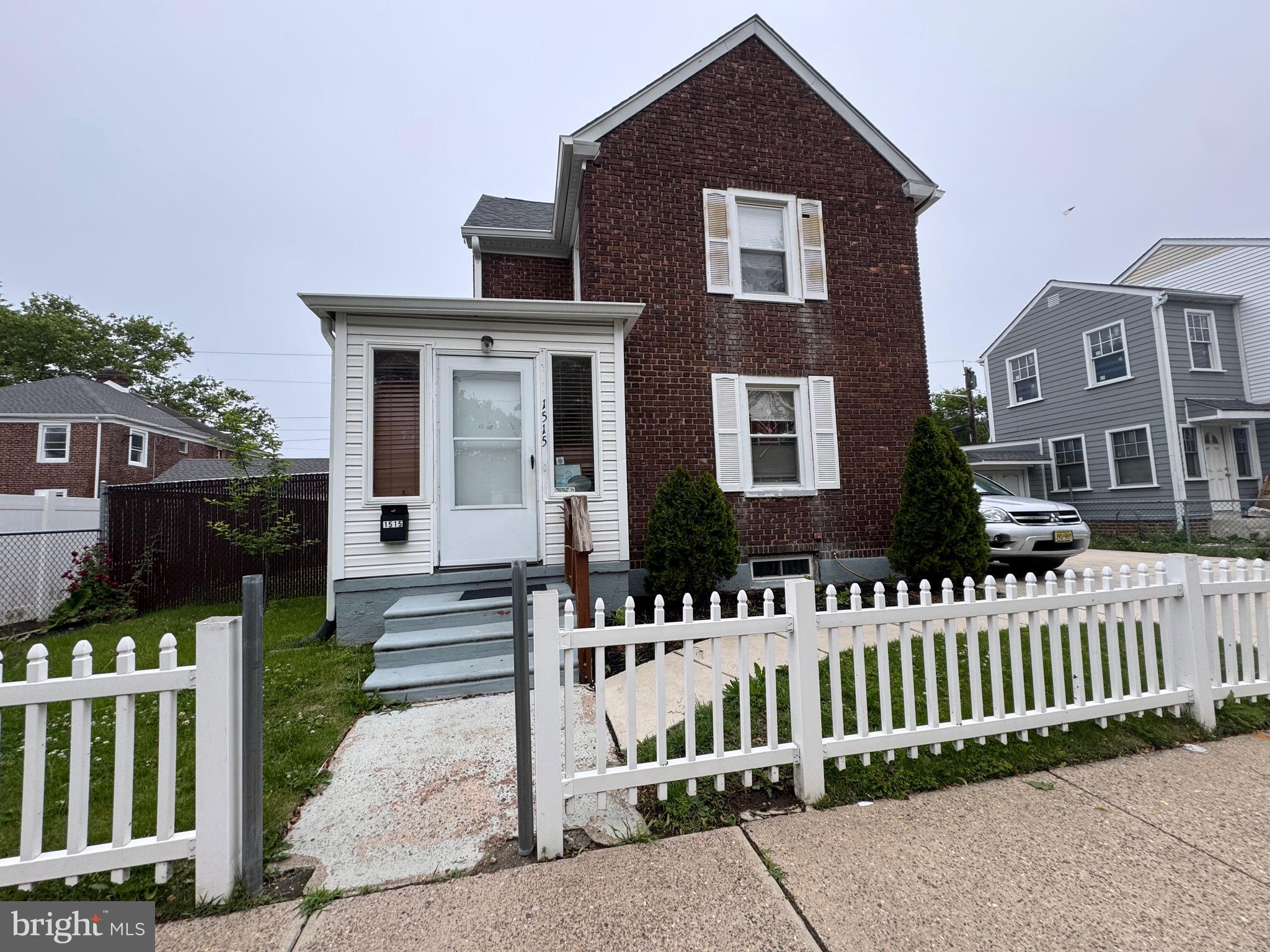 1515 Collings Road Camden, NJ 08104 - Photo 2 of 23 a front view of a house with a small yard