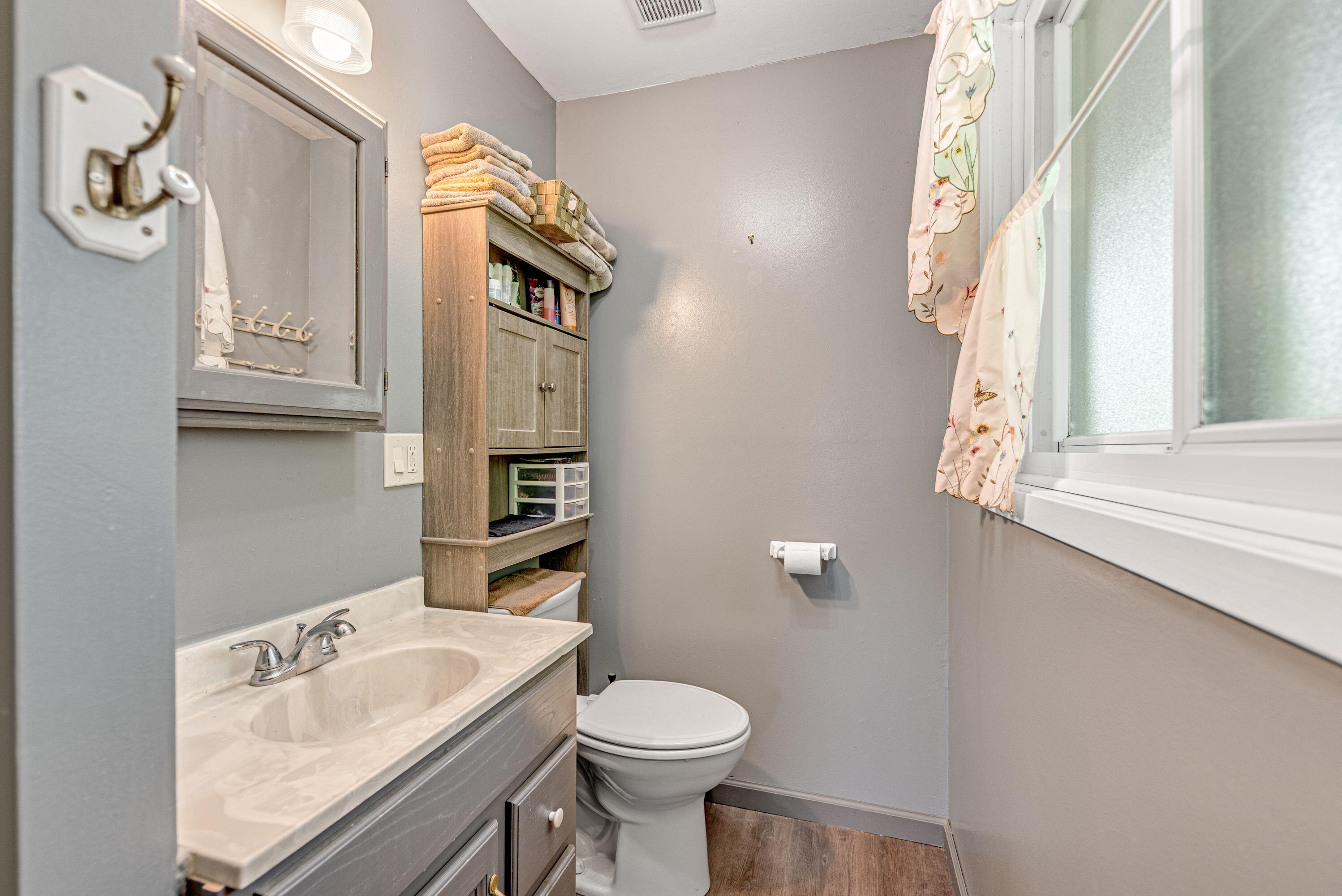 2337 Four Seasons Parkway Crown Point, IN 46307 - Photo 9 of 18 a bathroom with a sink a toilet and a mirror