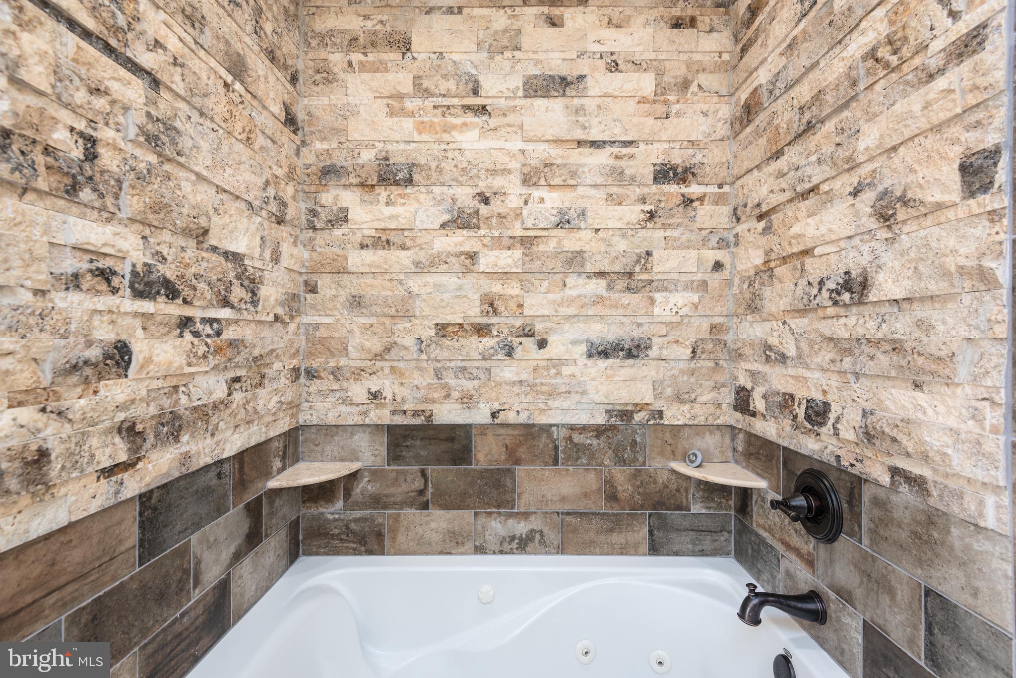 47 Queen Anne Way Chester, MD 21619 - Photo 14 of 44 a bathroom with a bathtub and a shower