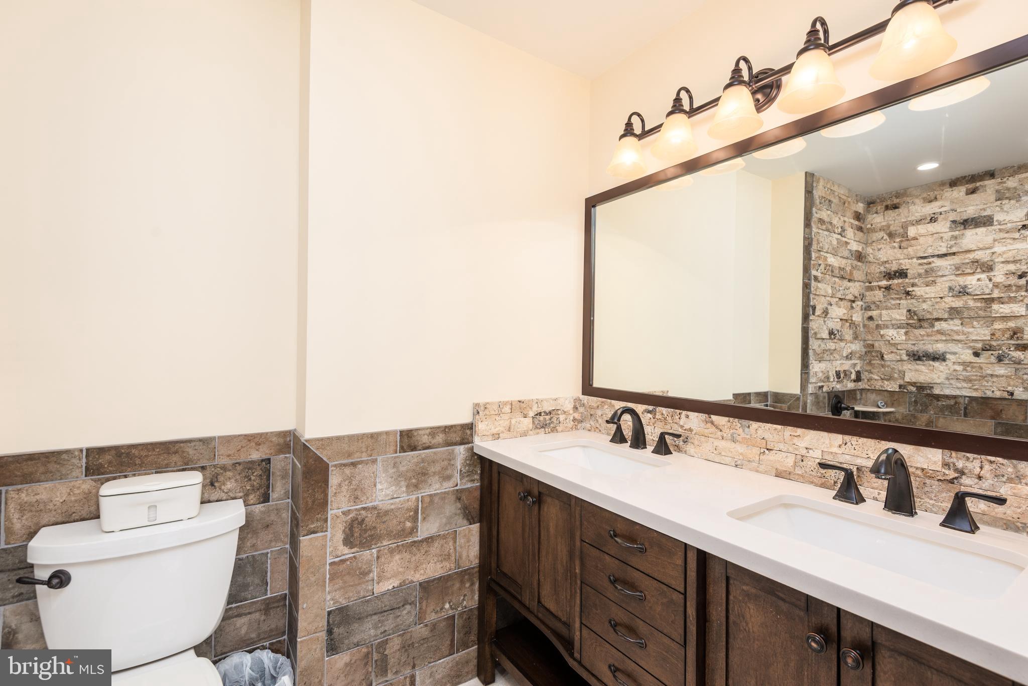 47 Queen Anne Way Chester, MD 21619 - Photo 20 of 44 a bathroom with a sink and a mirror