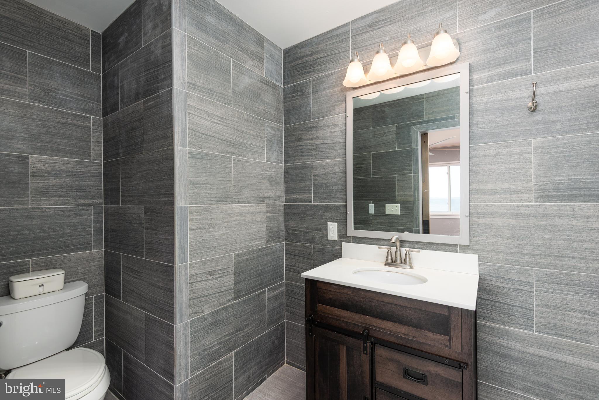 47 Queen Anne Way Chester, MD 21619 - Photo 27 of 44 a bathroom with a sink toilet and shower