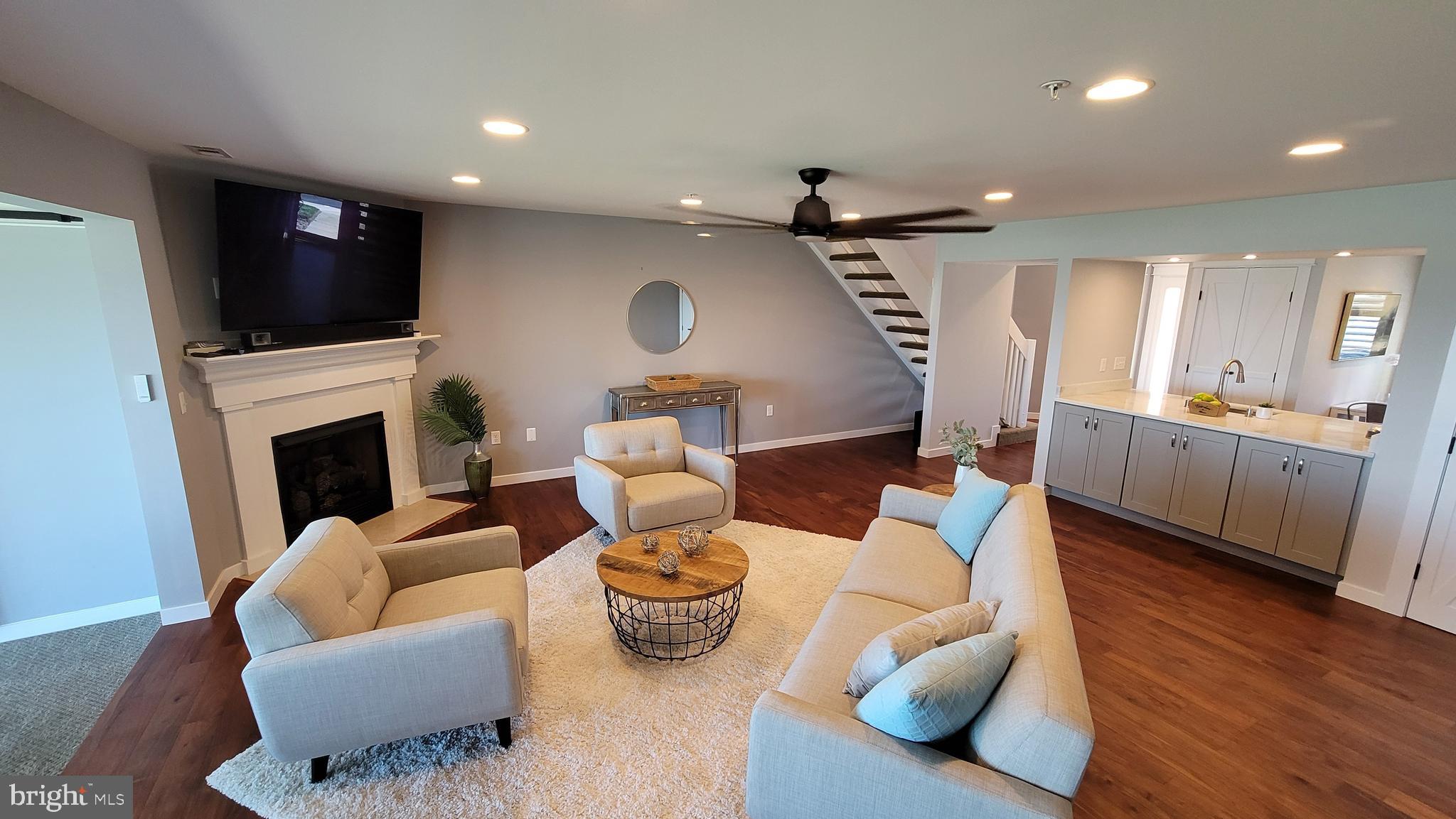 47 Queen Anne Way Chester, MD 21619 - Photo 6 of 44 a living room with furniture and a flat screen tv