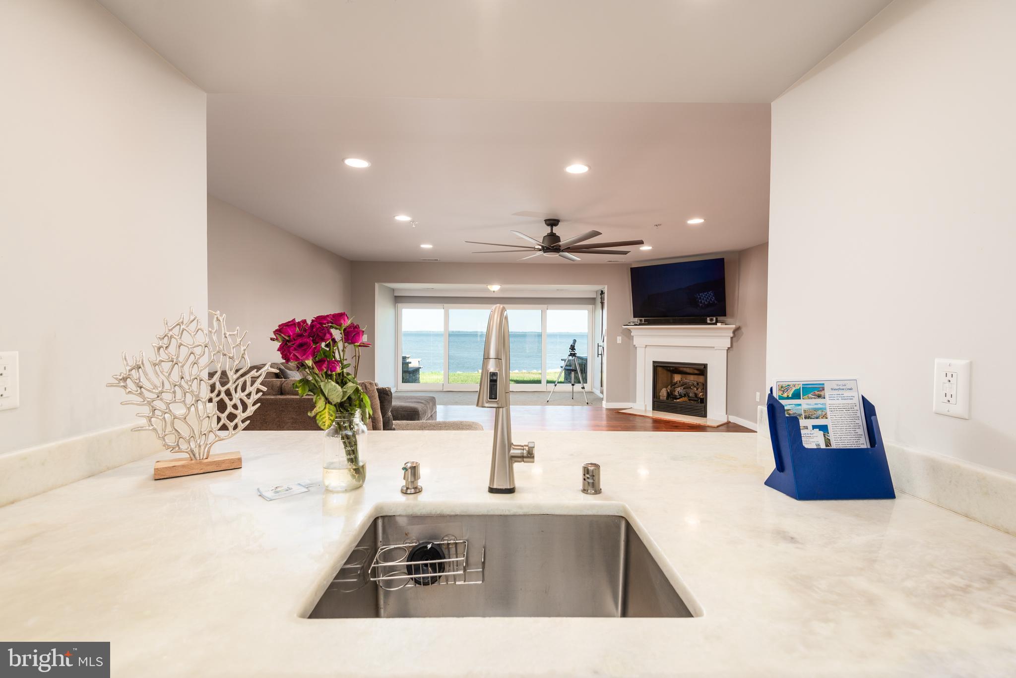 47 Queen Anne Way Chester, MD 21619 - Photo 9 of 44 a kitchen with granite countertop a sink and white cabinets