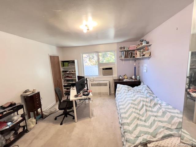 220-34 67th Avenue, Unit 2LEVELS Queens, NY 11364 - Photo 13 of 30 master Bedroom with radiator and an office area