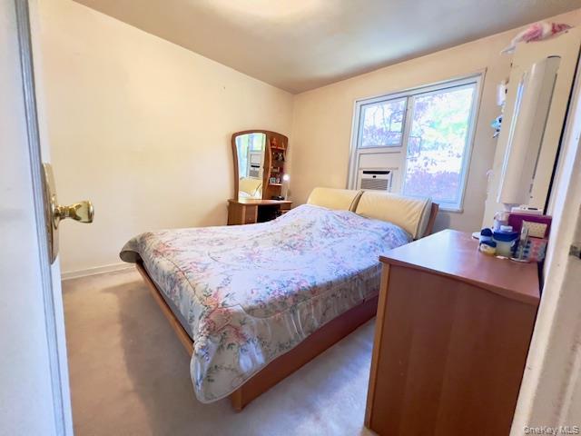 220-34 67th Avenue, Unit 2LEVELS Queens, NY 11364 - Photo 14 of 30 2nd Bedroom featuring light colored carpet and cooling unit