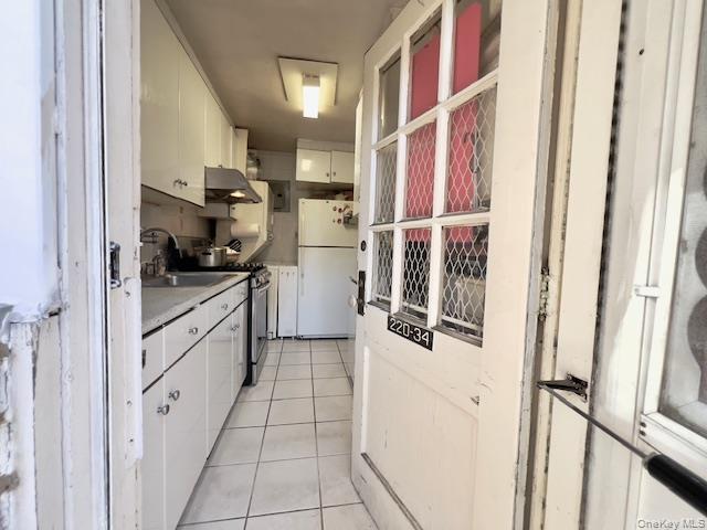 220-34 67th Avenue, Unit 2LEVELS Queens, NY 11364 - Photo 19 of 30 washer & dryer has installed in kitchen.