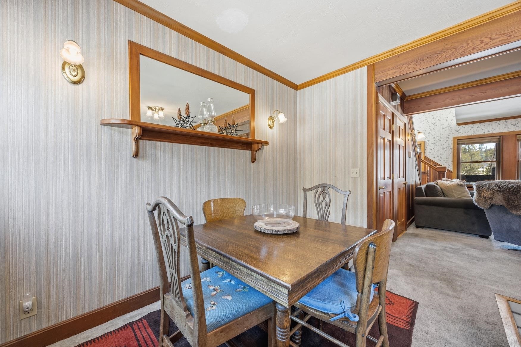 21501 Donner Pass Road, Unit 13 Soda Springs, CA 95728 - Photo 12 of 23 a view of a dining room with furniture and a chandelier