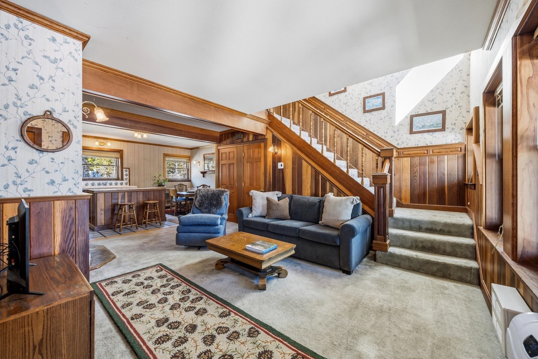 21501 Donner Pass Road, Unit 13 Soda Springs, CA 95728 - Photo 14 of 23 a living room with furniture and a rug