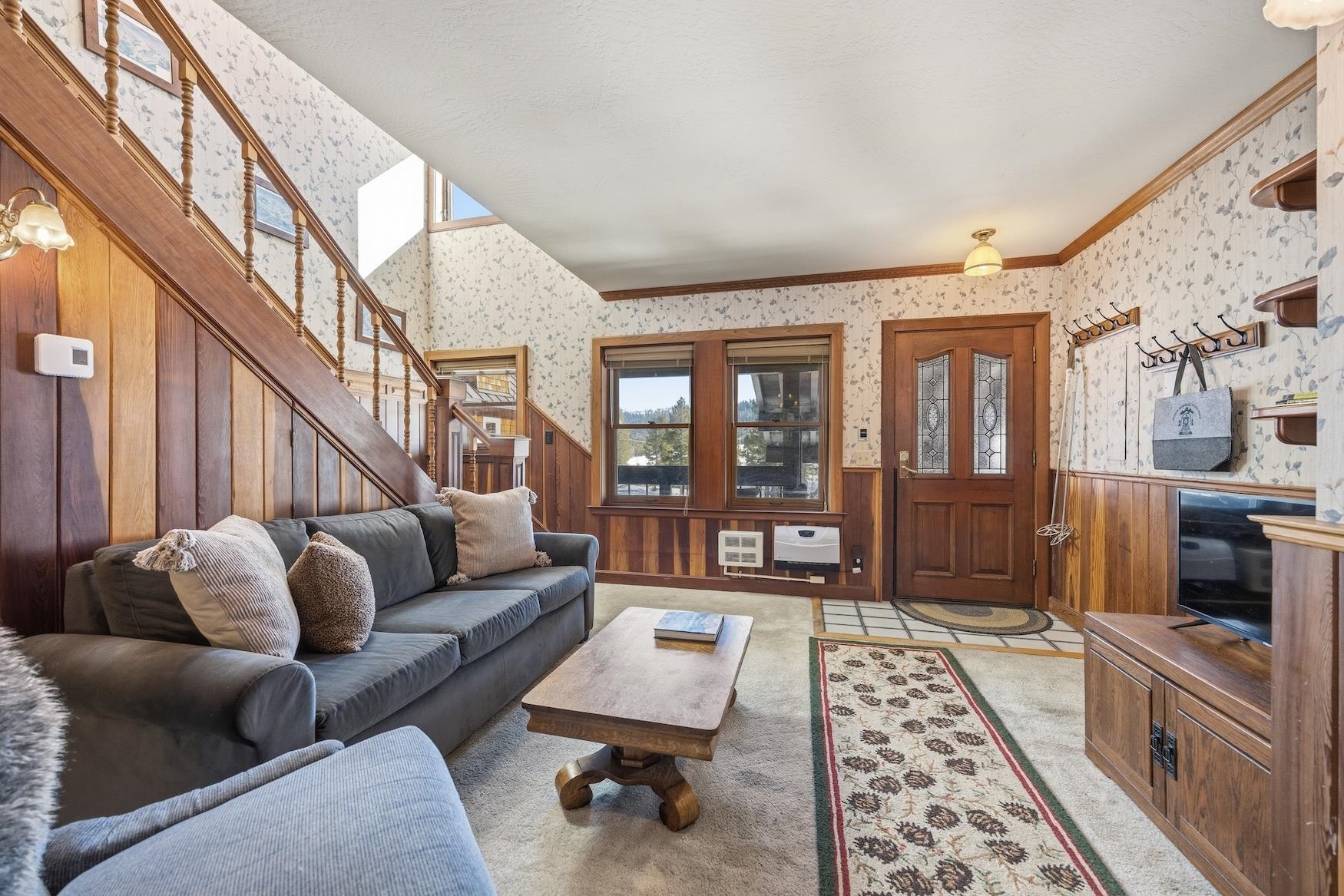 21501 Donner Pass Road, Unit 13 Soda Springs, CA 95728 - Photo 2 of 23 a living room with furniture and a rug