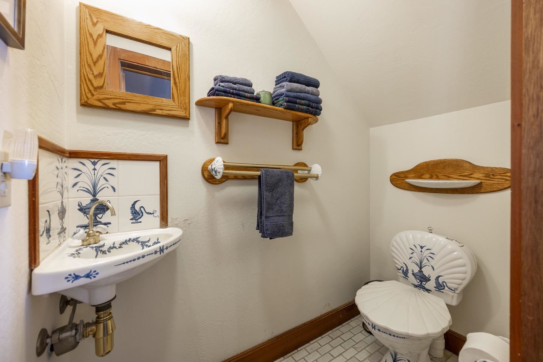 21501 Donner Pass Road, Unit 13 Soda Springs, CA 95728 - Photo 3 of 23 a bathroom with a sink a toilet and mirror