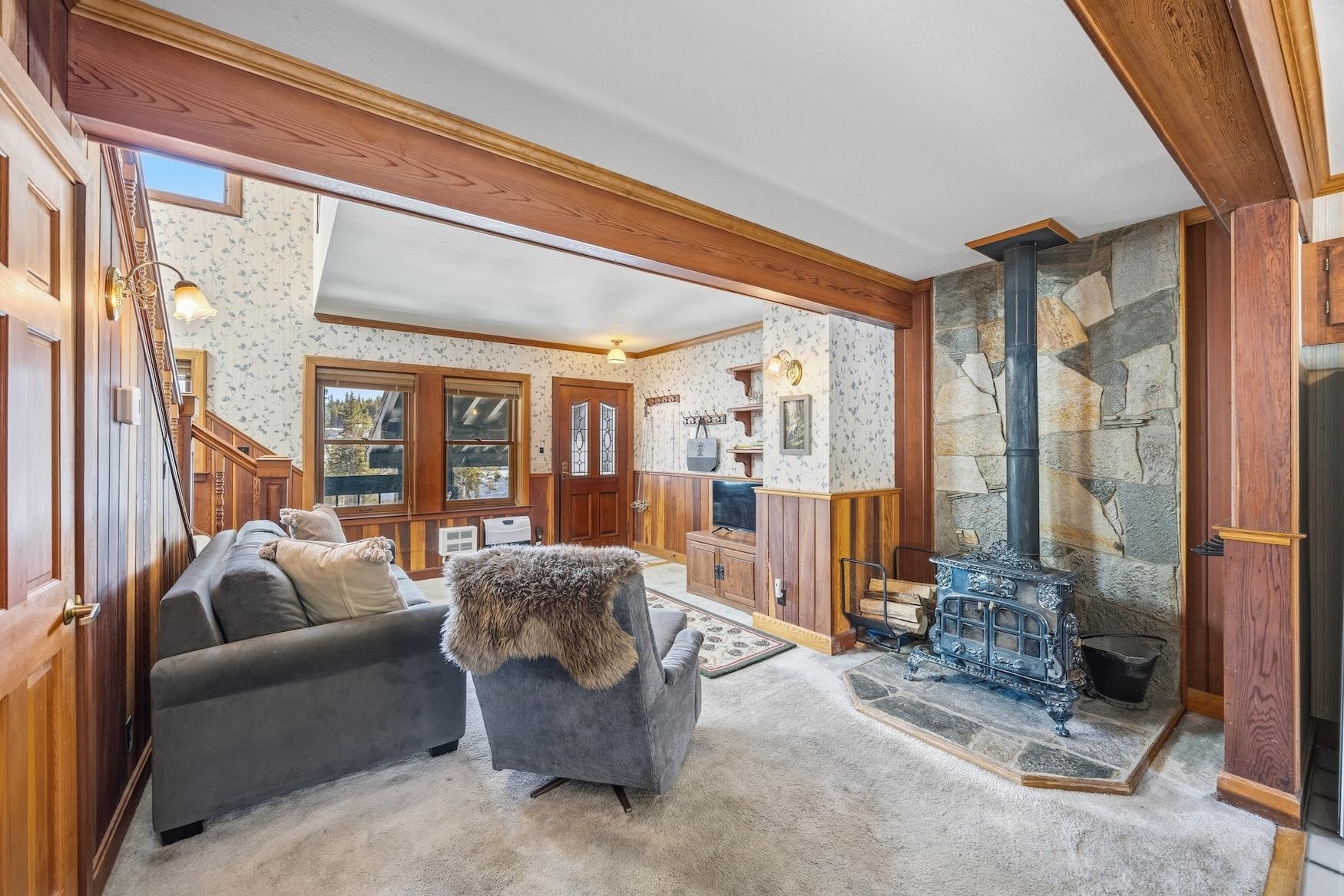21501 Donner Pass Road, Unit 13 Soda Springs, CA 95728 - Photo 5 of 23 a living room with furniture and a floor to ceiling window