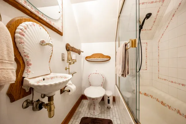 a view of a hallway with wooden floor and stairs