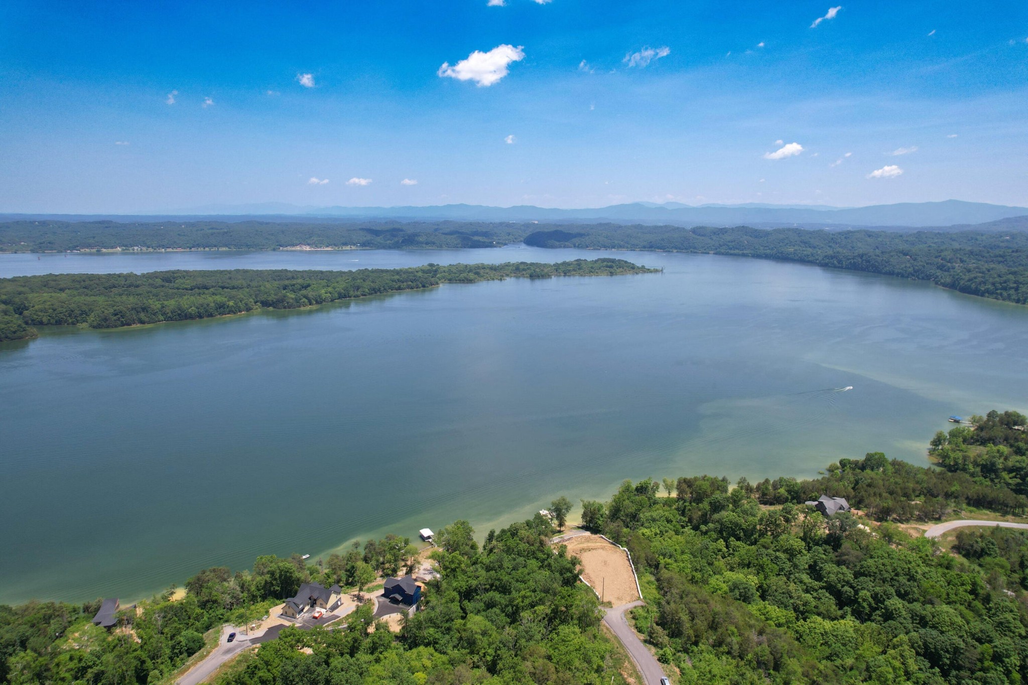 74 Clear Point Dandridge, TN 37725 - Photo 16 of 29 a view of a lake and a yard