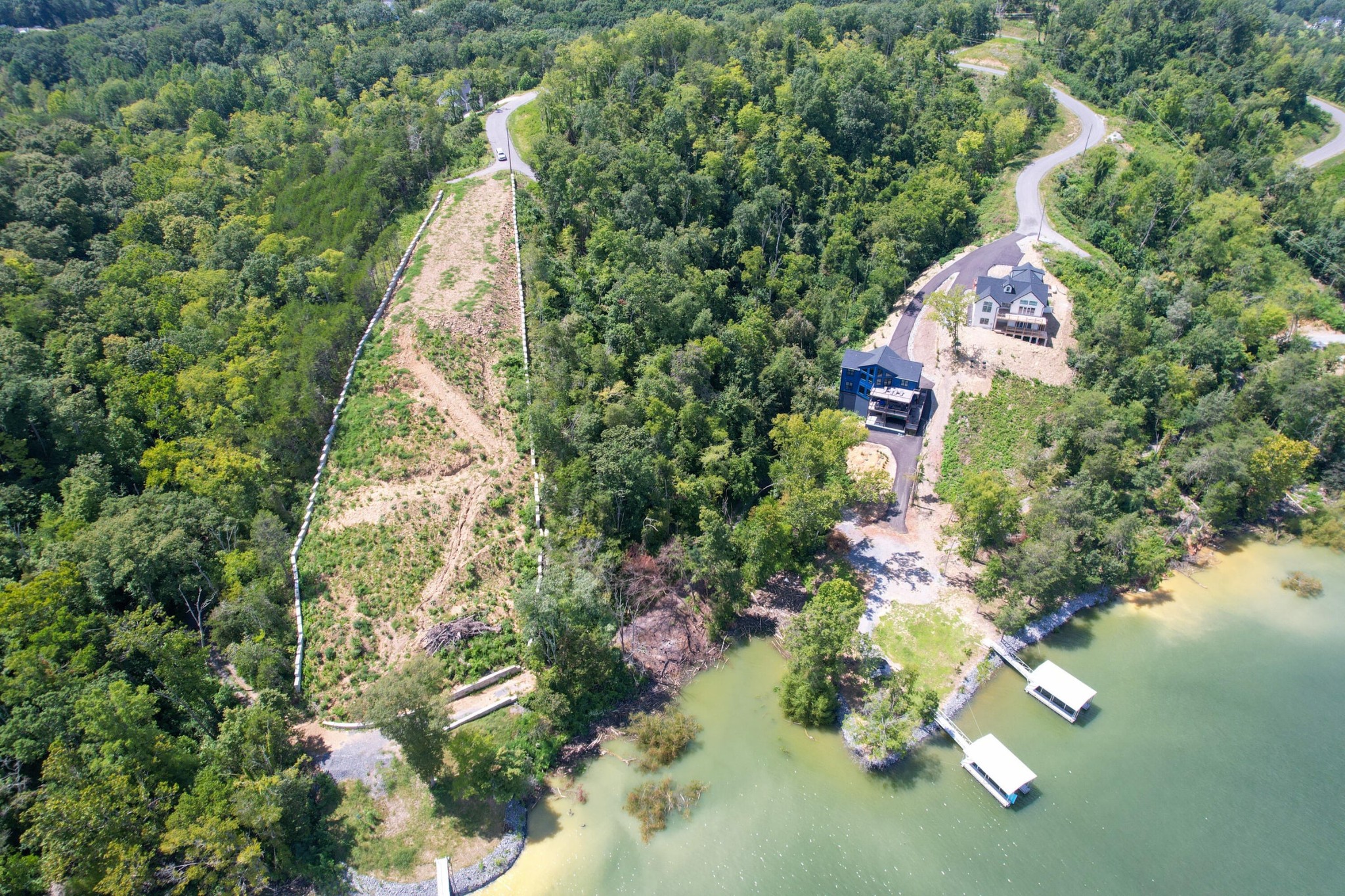 74 Clear Point Dandridge, TN 37725 - Photo 3 of 29 an aerial view of a house with a yard and garden