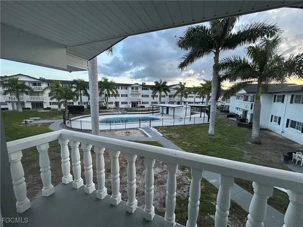 a view of a porch and yard