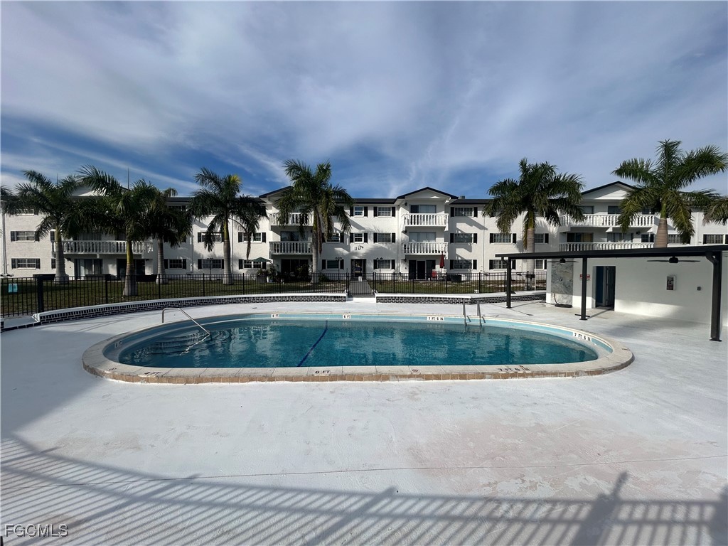3706 Broadway, Unit 29 Fort Myers, FL 33901 - Photo 12 of 15 a view of building and car parked