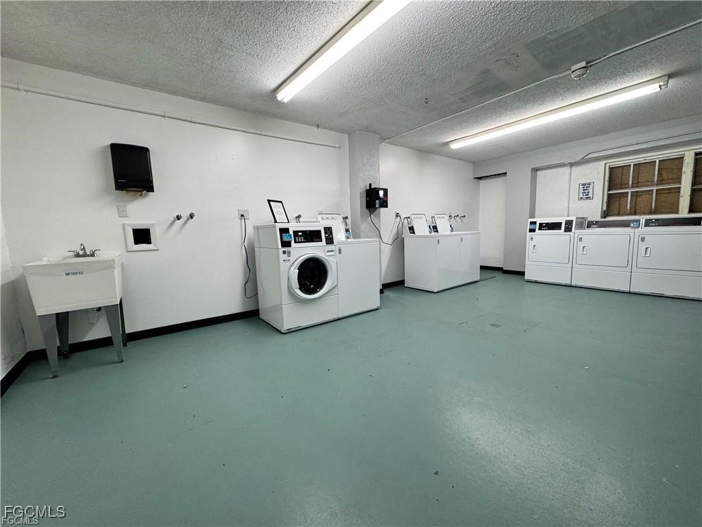 3706 Broadway, Unit 29 Fort Myers, FL 33901 - Photo 13 of 15 a utility room with multiple dryer and washer
