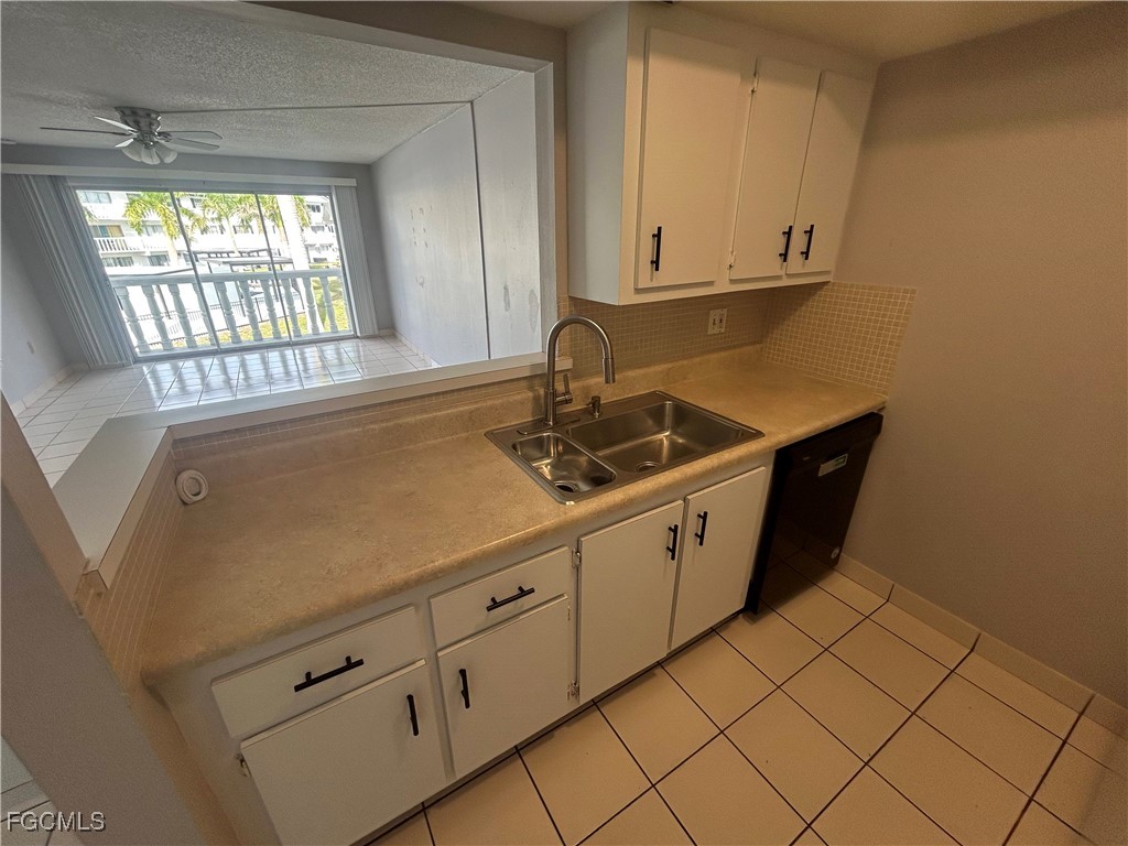 3706 Broadway, Unit 29 Fort Myers, FL 33901 - Photo 6 of 15 a utility room with cabinets