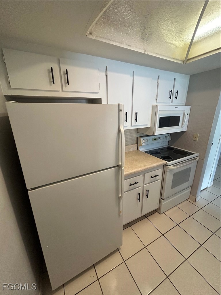 3706 Broadway, Unit 29 Fort Myers, FL 33901 - Photo 7 of 15 a white refrigerator freezer sitting inside of a kitchen