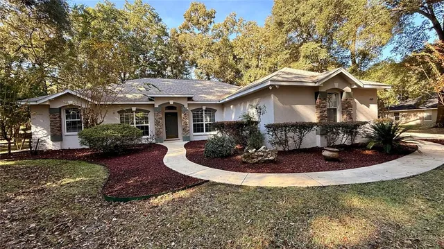 a front view of a house with a yard and porch