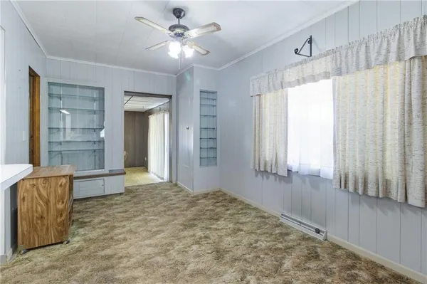 a view of an empty room and window