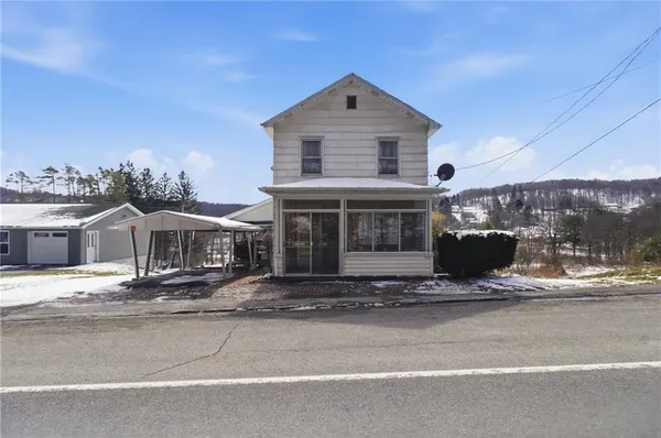 a front view of a house with a porch