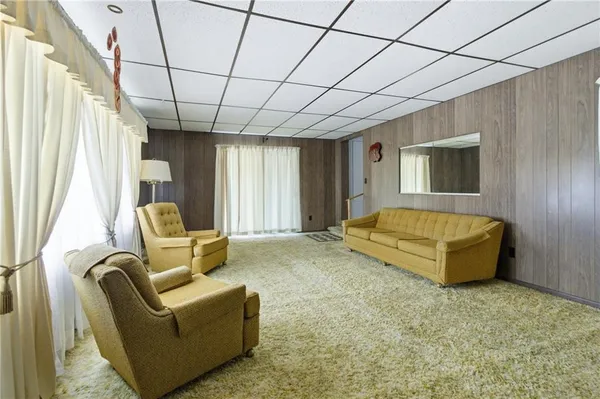 a spacious bedroom with a bed and a couch