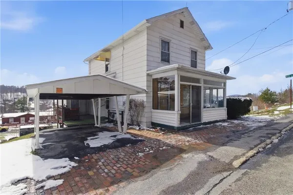 a front view of a house with yard