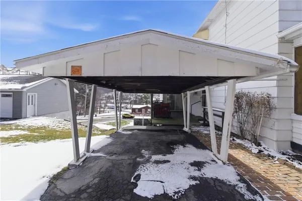 a backyard of a house with yard and outdoor seating