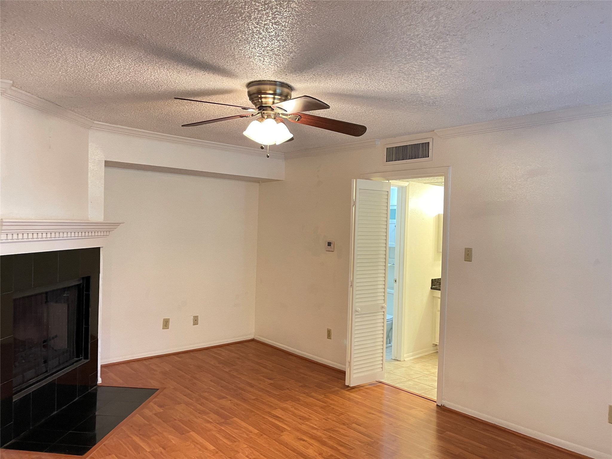 2800 Jeanetta Street, Unit 2204 Houston, TX 77063 - Photo 14 of 28 a view of empty room with wooden floor and fan