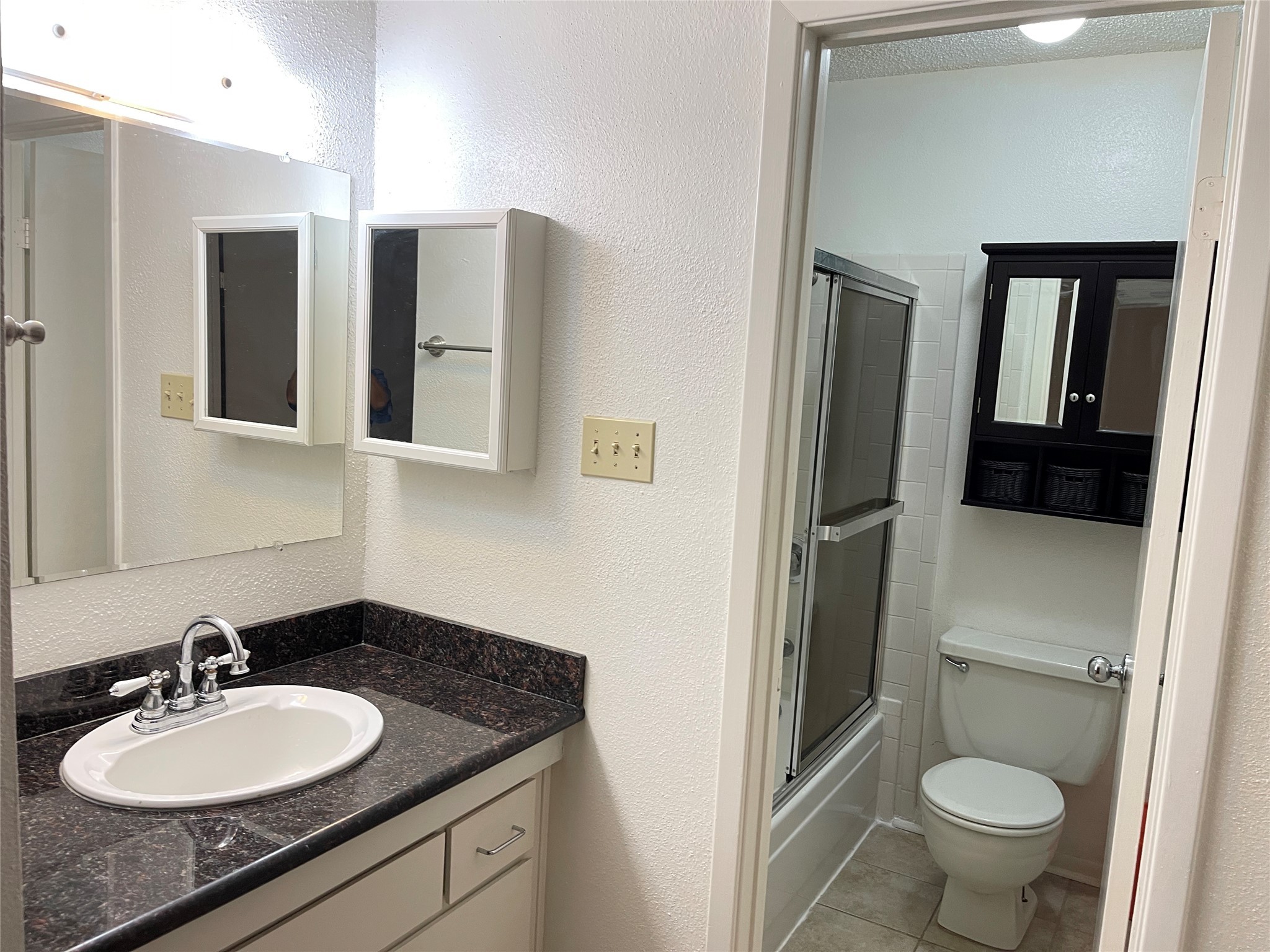 2800 Jeanetta Street, Unit 2204 Houston, TX 77063 - Photo 16 of 28 a bathroom with a granite countertop sink toilet and mirror