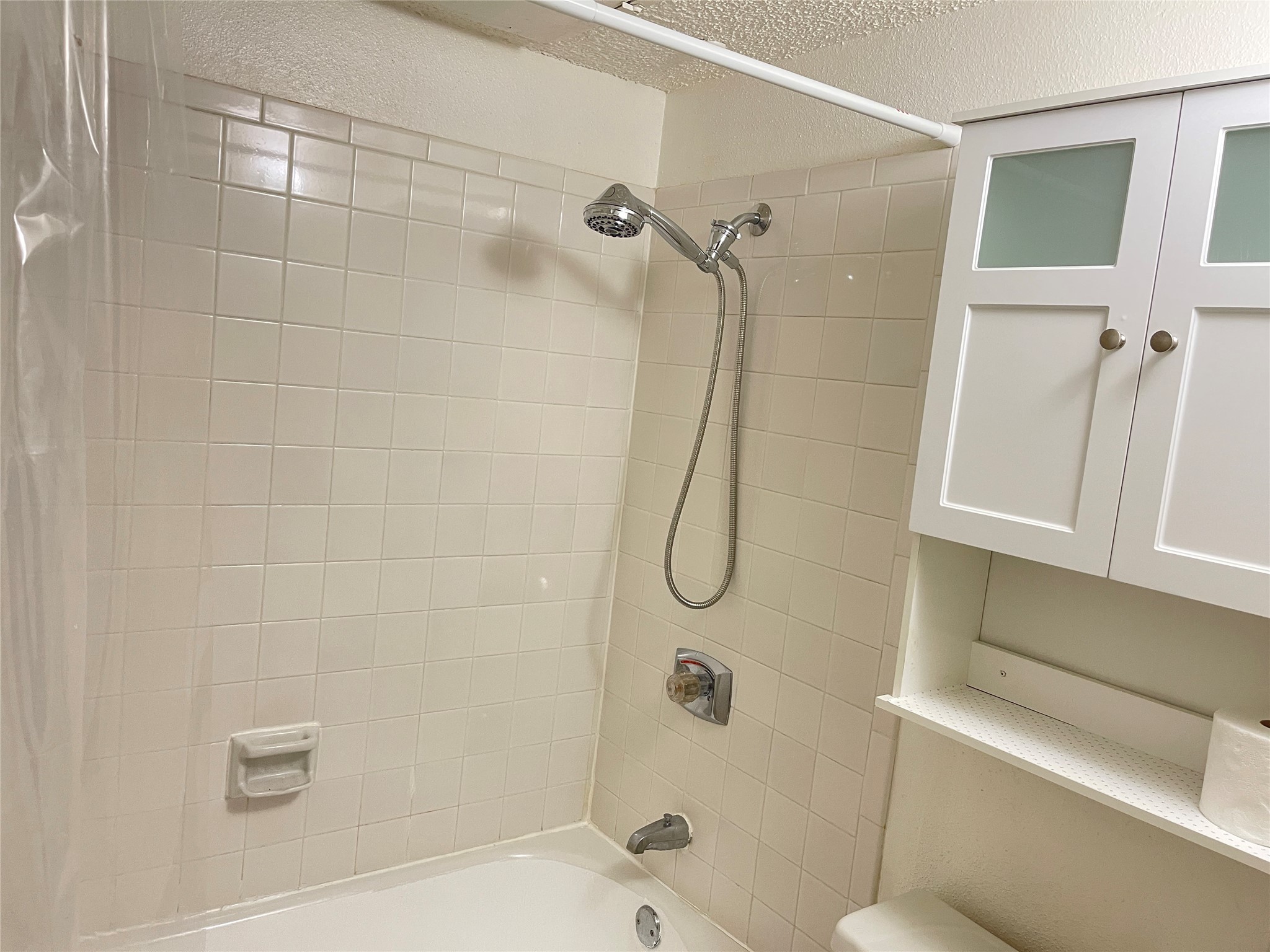 2800 Jeanetta Street, Unit 2204 Houston, TX 77063 - Photo 18 of 28 a bathroom with a shower and toilet