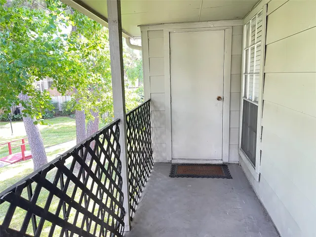 a view of entryway with wooden floor and stairs
