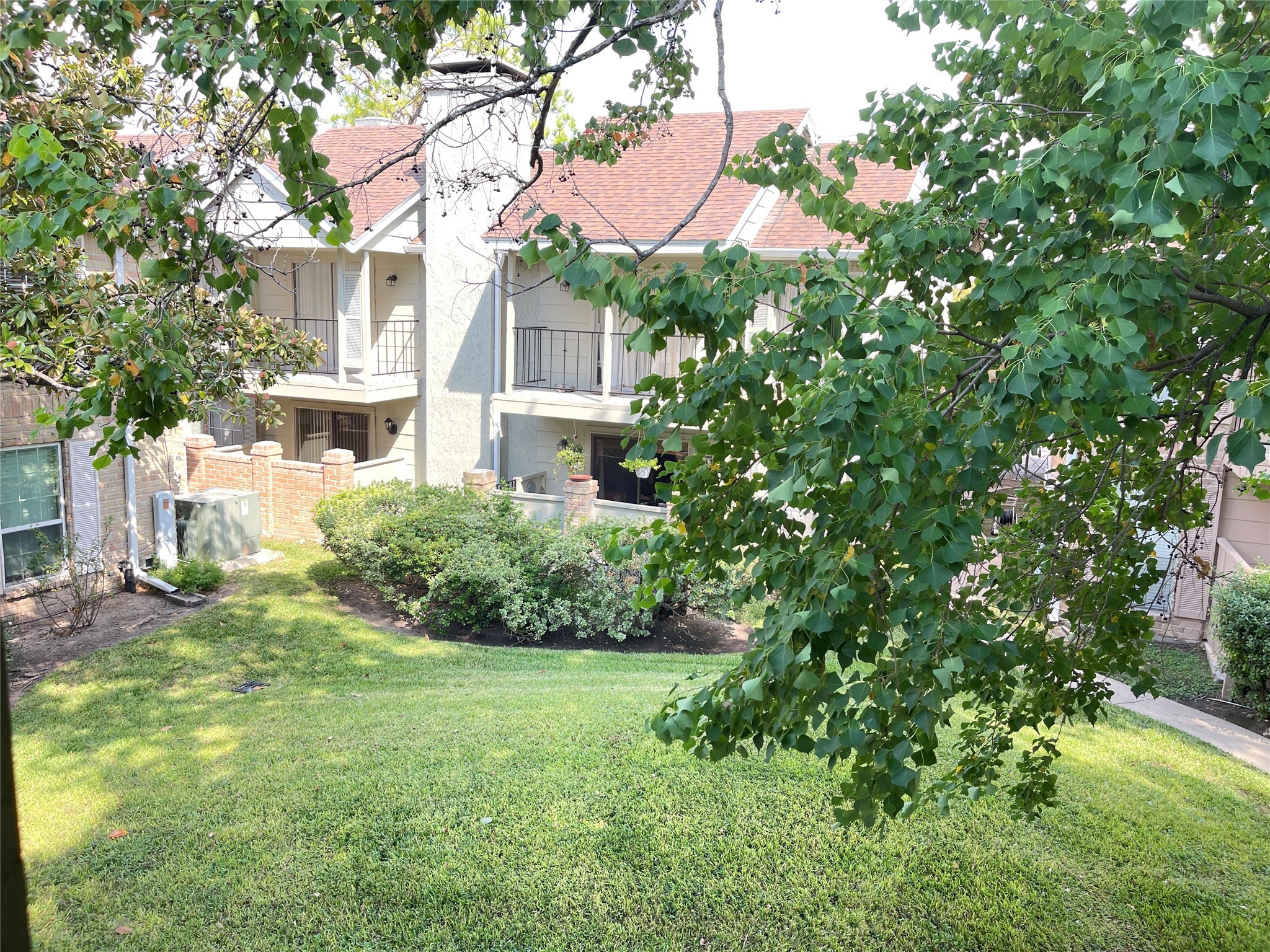 2800 Jeanetta Street, Unit 2204 Houston, TX 77063 - Photo 22 of 28 a view of a house with a yard