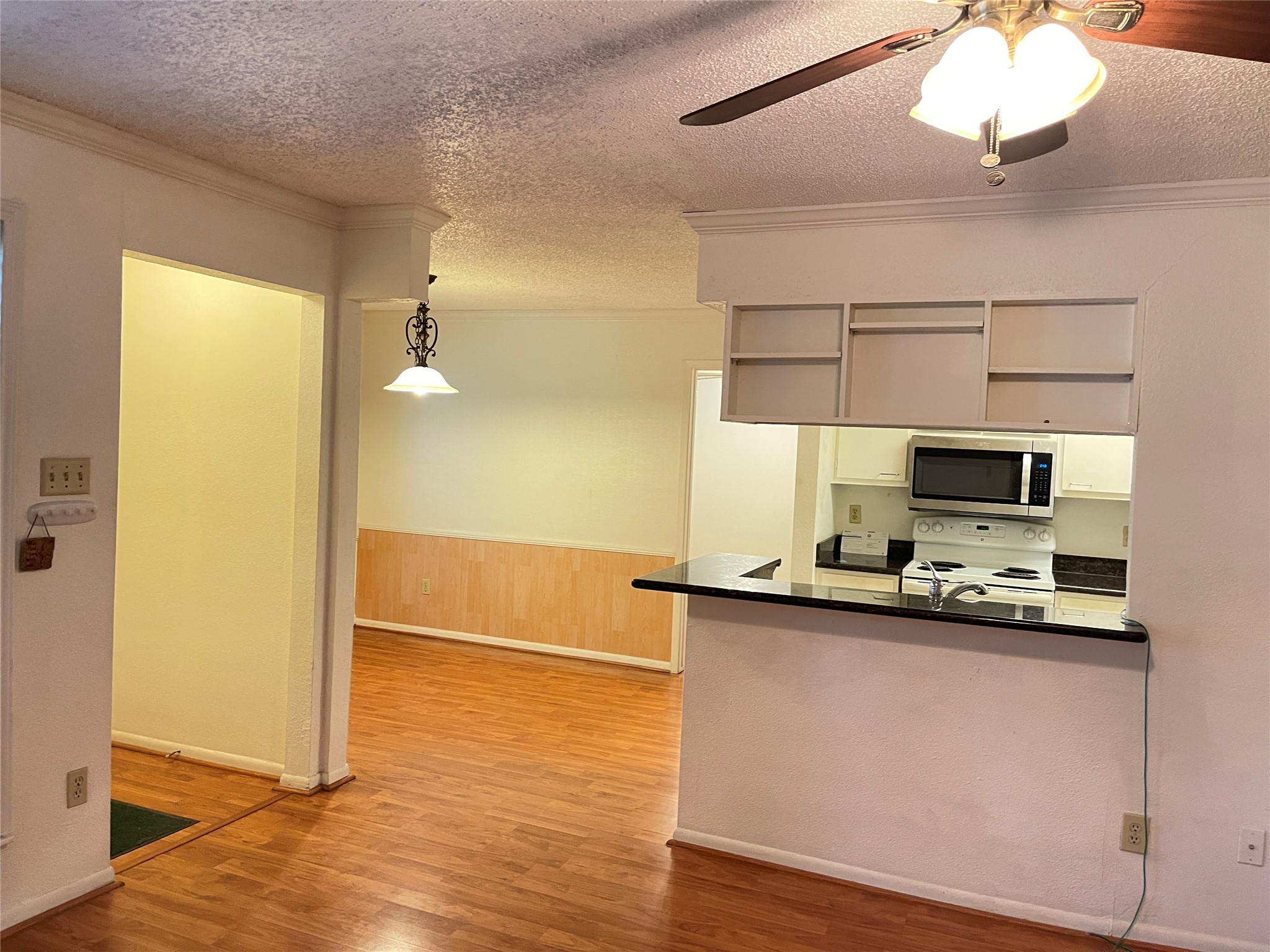 2800 Jeanetta Street, Unit 2204 Houston, TX 77063 - Photo 7 of 28 a kitchen with stainless steel appliances a sink and a microwave