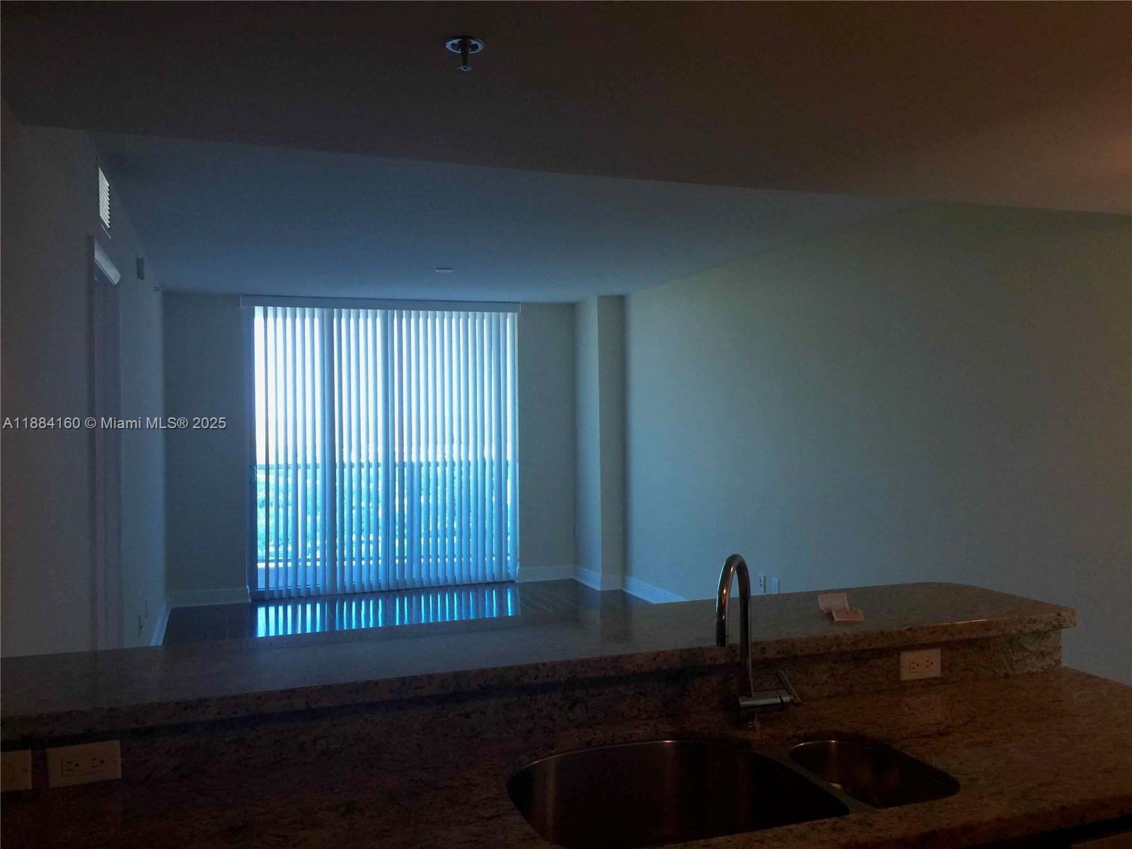 2641 North Flamingo Road, Unit 1705N Sunrise, FL 33323 - Photo 11 of 56 a living room with furniture and a window