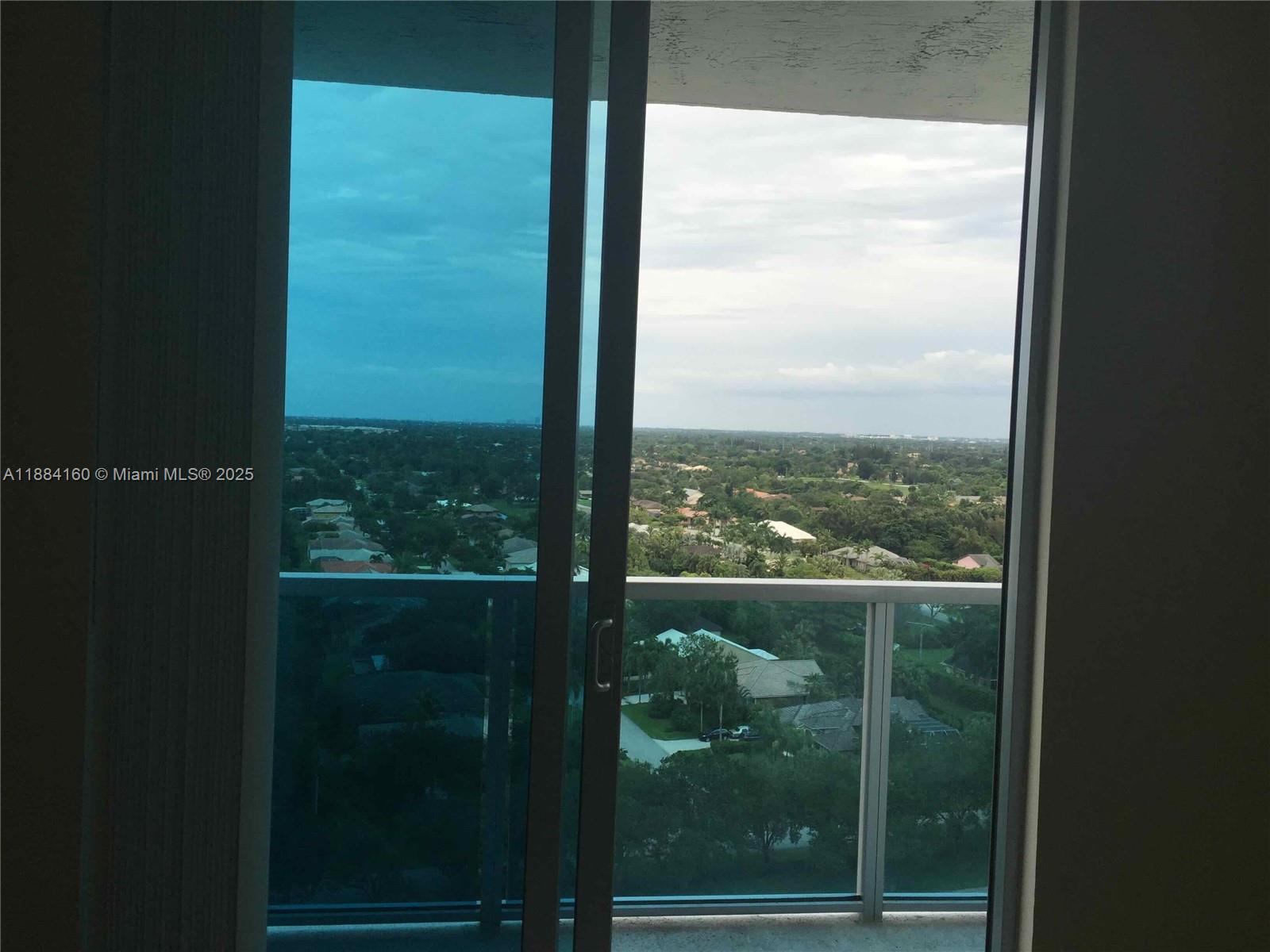 2641 North Flamingo Road, Unit 1705N Sunrise, FL 33323 - Photo 14 of 56 a view of a glass building from a window