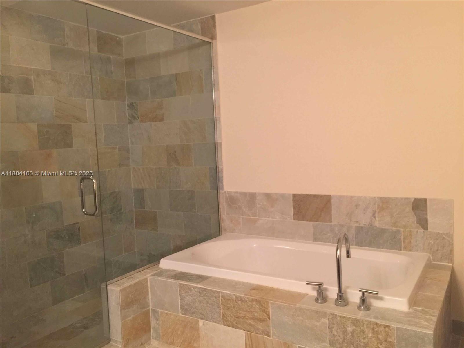 2641 North Flamingo Road, Unit 1705N Sunrise, FL 33323 - Photo 23 of 56 a bathroom with a shower