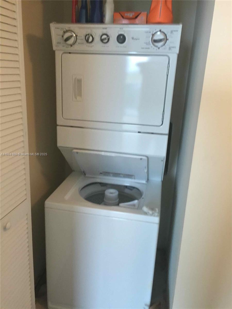 2641 North Flamingo Road, Unit 1705N Sunrise, FL 33323 - Photo 31 of 56 a utility room with dryer and washer