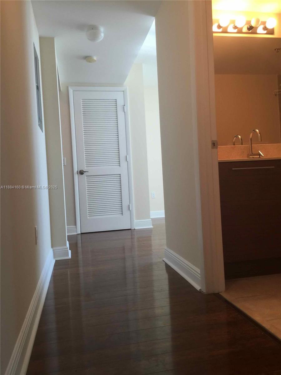 2641 North Flamingo Road, Unit 1705N Sunrise, FL 33323 - Photo 32 of 56 an empty room with wooden floor and closet