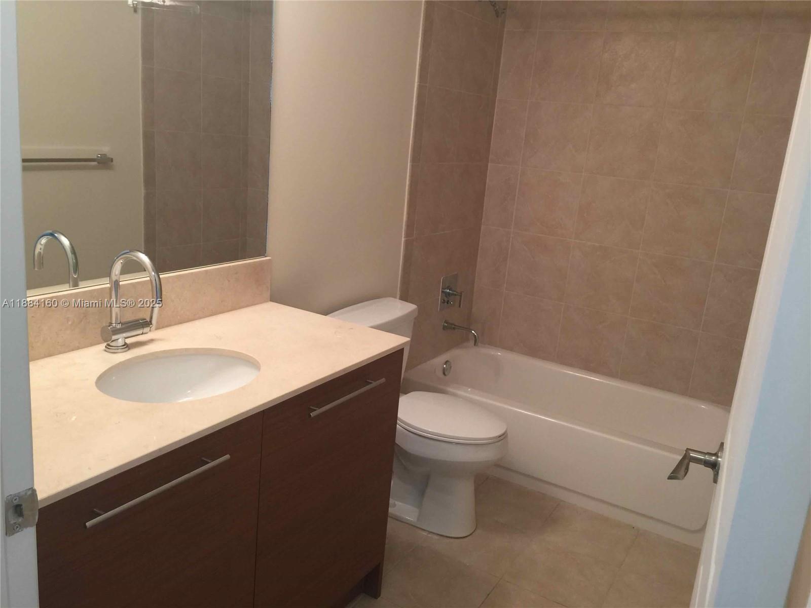 2641 North Flamingo Road, Unit 1705N Sunrise, FL 33323 - Photo 34 of 56 a bathroom with a sink and a mirror
