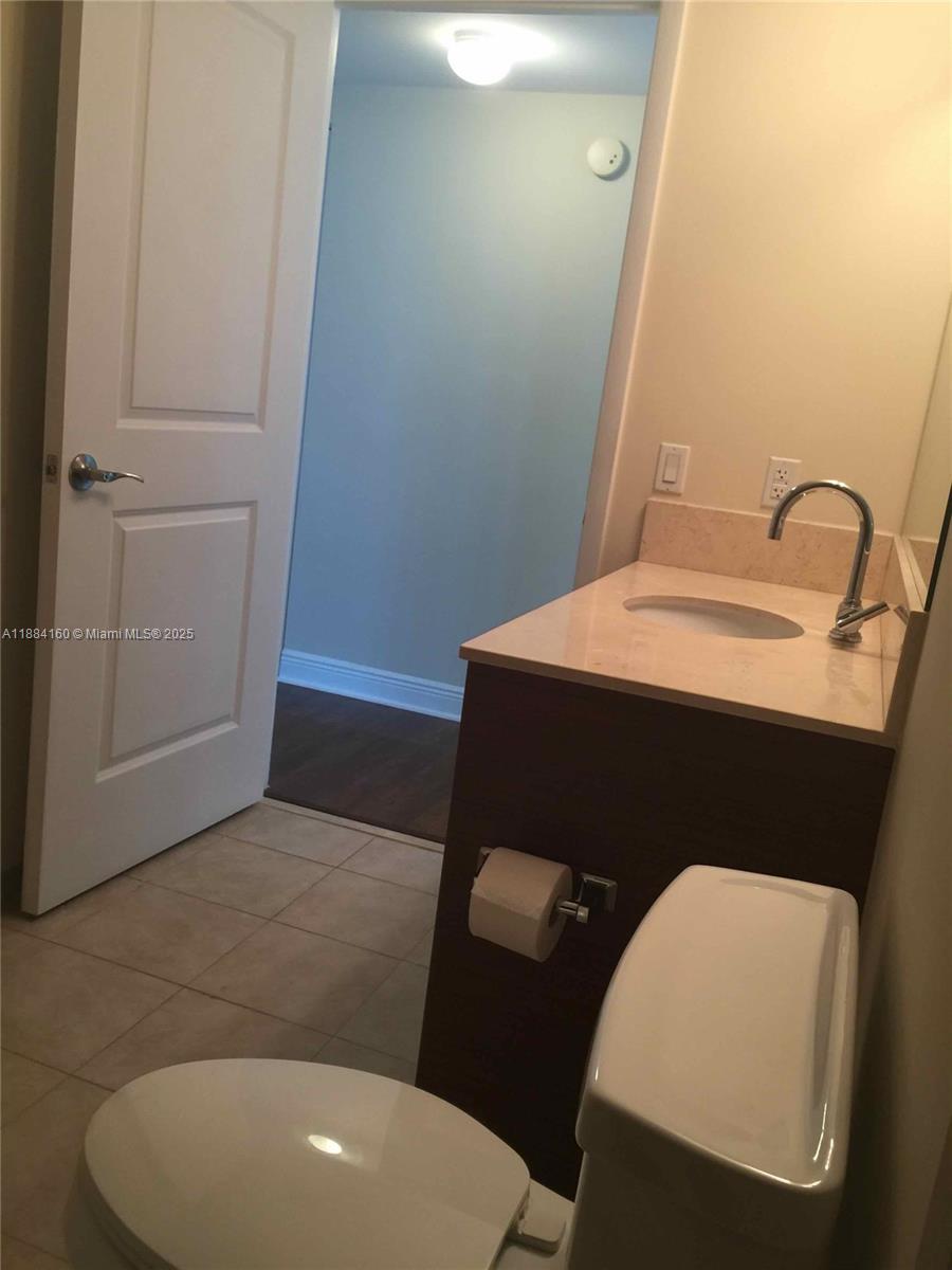 2641 North Flamingo Road, Unit 1705N Sunrise, FL 33323 - Photo 38 of 56 a bathroom with a sink and a mirror