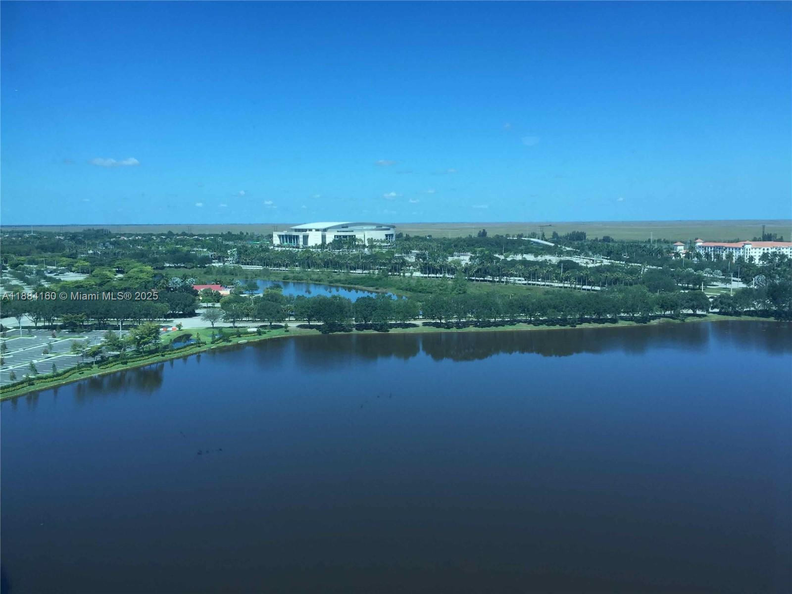 2641 North Flamingo Road, Unit 1705N Sunrise, FL 33323 - Photo 47 of 56 a view of a lake with a city