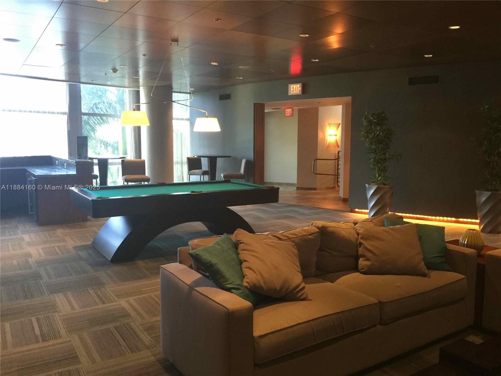 2641 North Flamingo Road, Unit 1705N Sunrise, FL 33323 - Photo 53 of 56 a living room with furniture and a large window