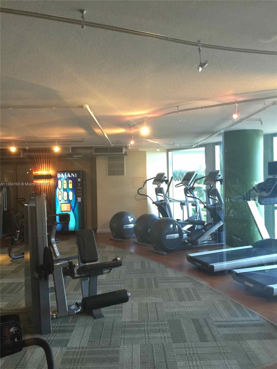 2641 North Flamingo Road, Unit 1705N Sunrise, FL 33323 - Photo 54 of 56 a view of a room with gym equipment