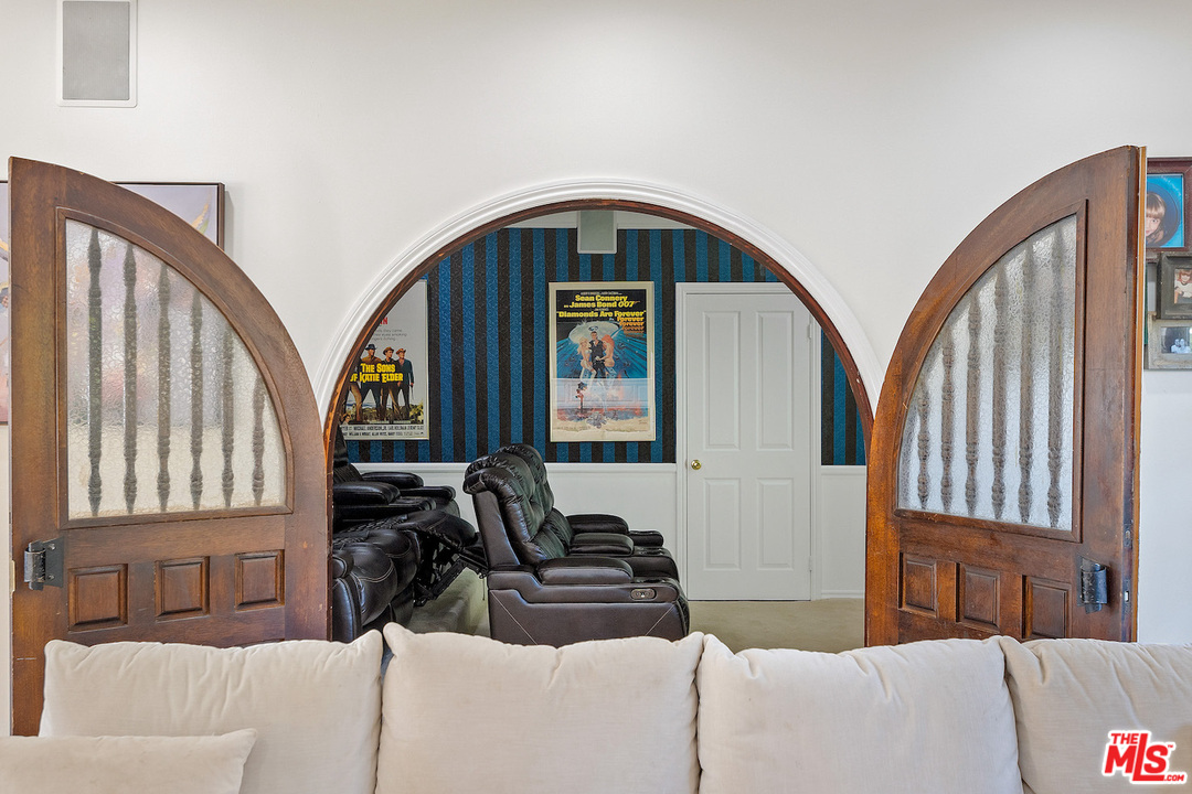 129 Saddlebow Road Bell Canyon, CA 91307 - Photo 11 of 39 a living room with furniture and large windows