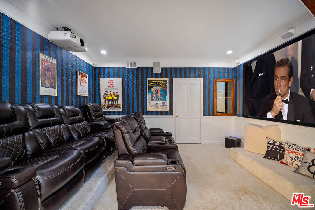 129 Saddlebow Road Bell Canyon, CA 91307 - Photo 12 of 39 a living room with furniture and a flat screen tv