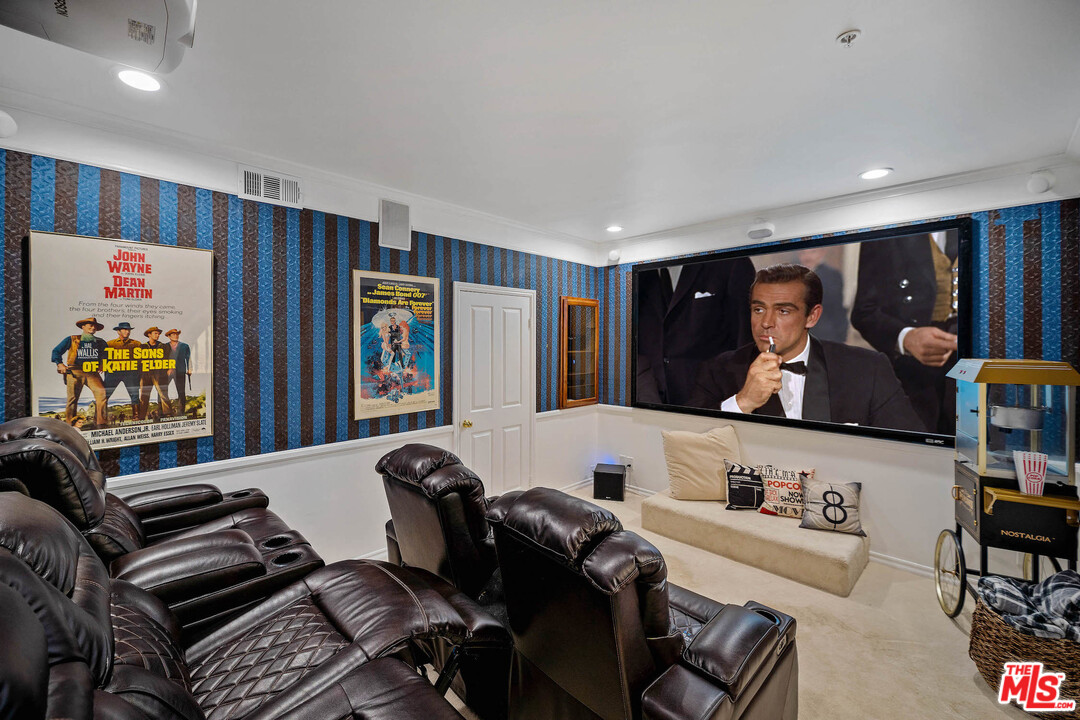 129 Saddlebow Road Bell Canyon, CA 91307 - Photo 13 of 39 a living room with furniture and a flat screen tv