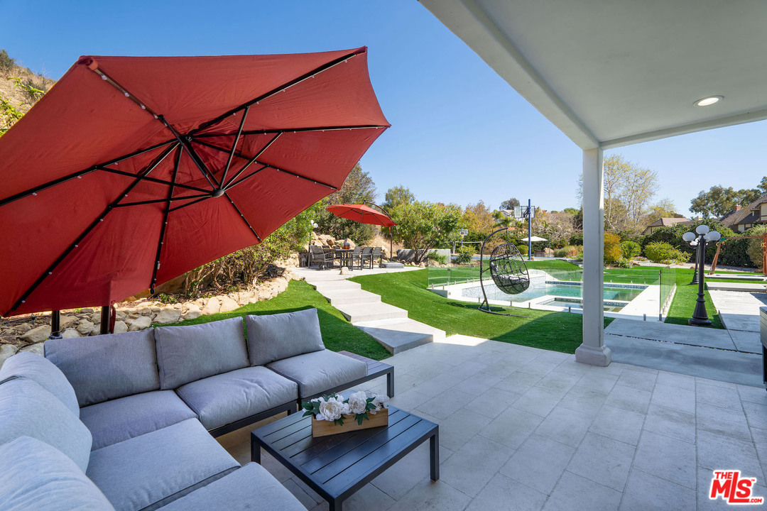 129 Saddlebow Road Bell Canyon, CA 91307 - Photo 15 of 39 a view of a two couches in a patio