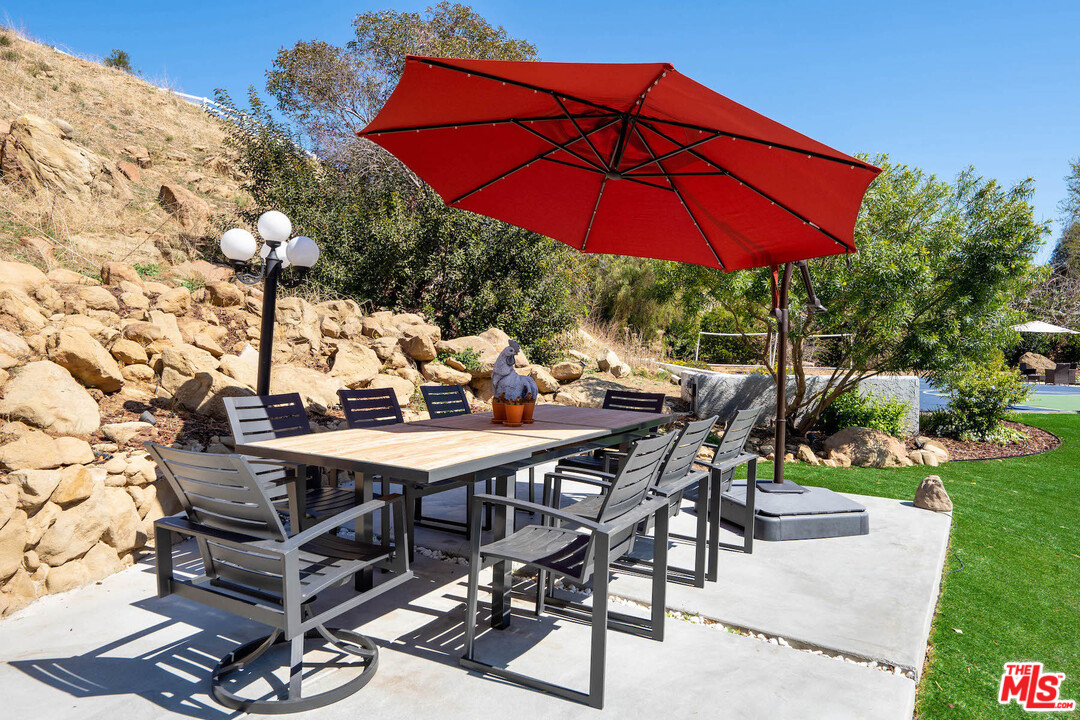 129 Saddlebow Road Bell Canyon, CA 91307 - Photo 18 of 39 a view of a backyard with sitting area and furniture